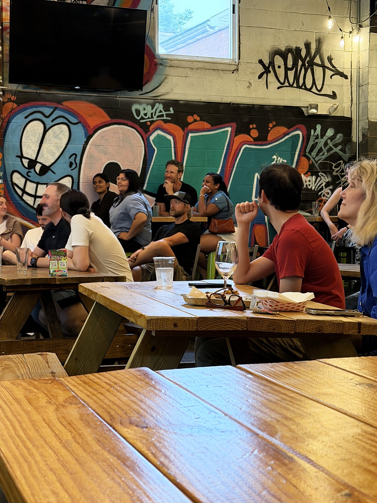 Attendees gathered around a table during the talk